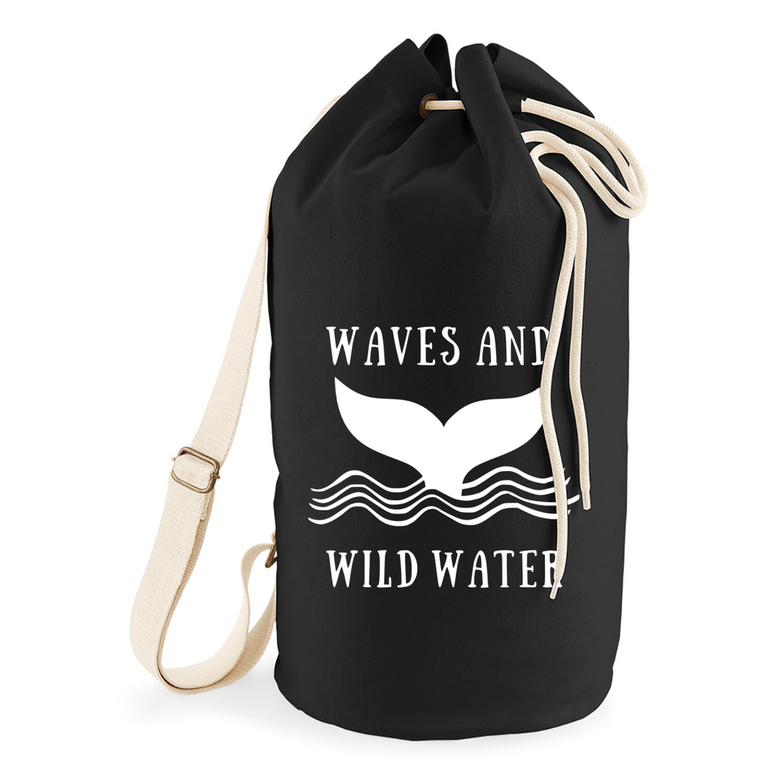 Salty Sea Bag in Night Sky black, only from Waves and Wild Water. Wild swimmers and sea dippers love this 20 litre shoulder bag for all their cold dipping adventure kit. The black bag looks great with the whale tail logo printed across the front in white.