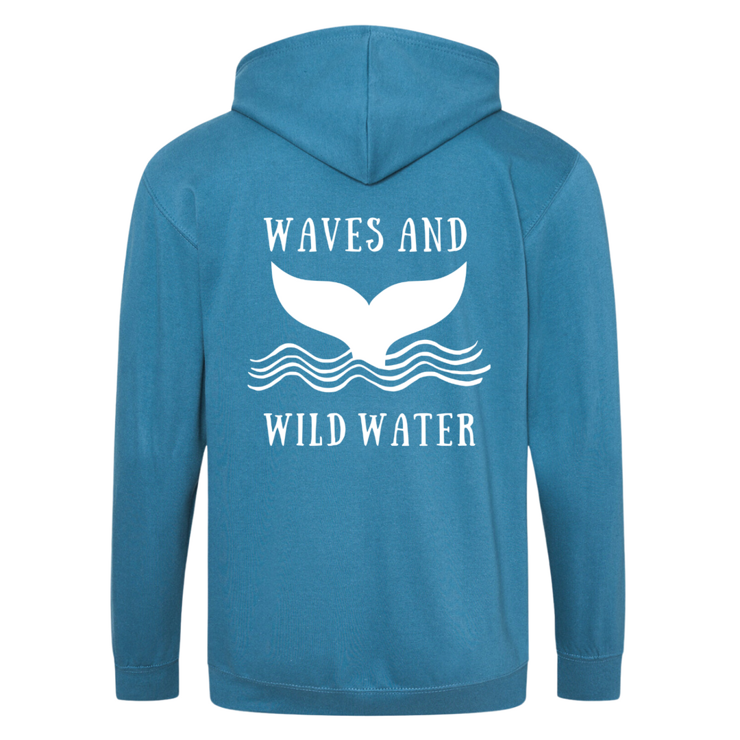 The back of the Waves and Wild Water Ocean Depths hoodie showing the large whale tail logo coming out of the waves. The logo is hand printed in white vegan ink and contrasts perfectly with the tropical blue of the hoodie, making this the go to choice for wild  simmers and sea dippers.