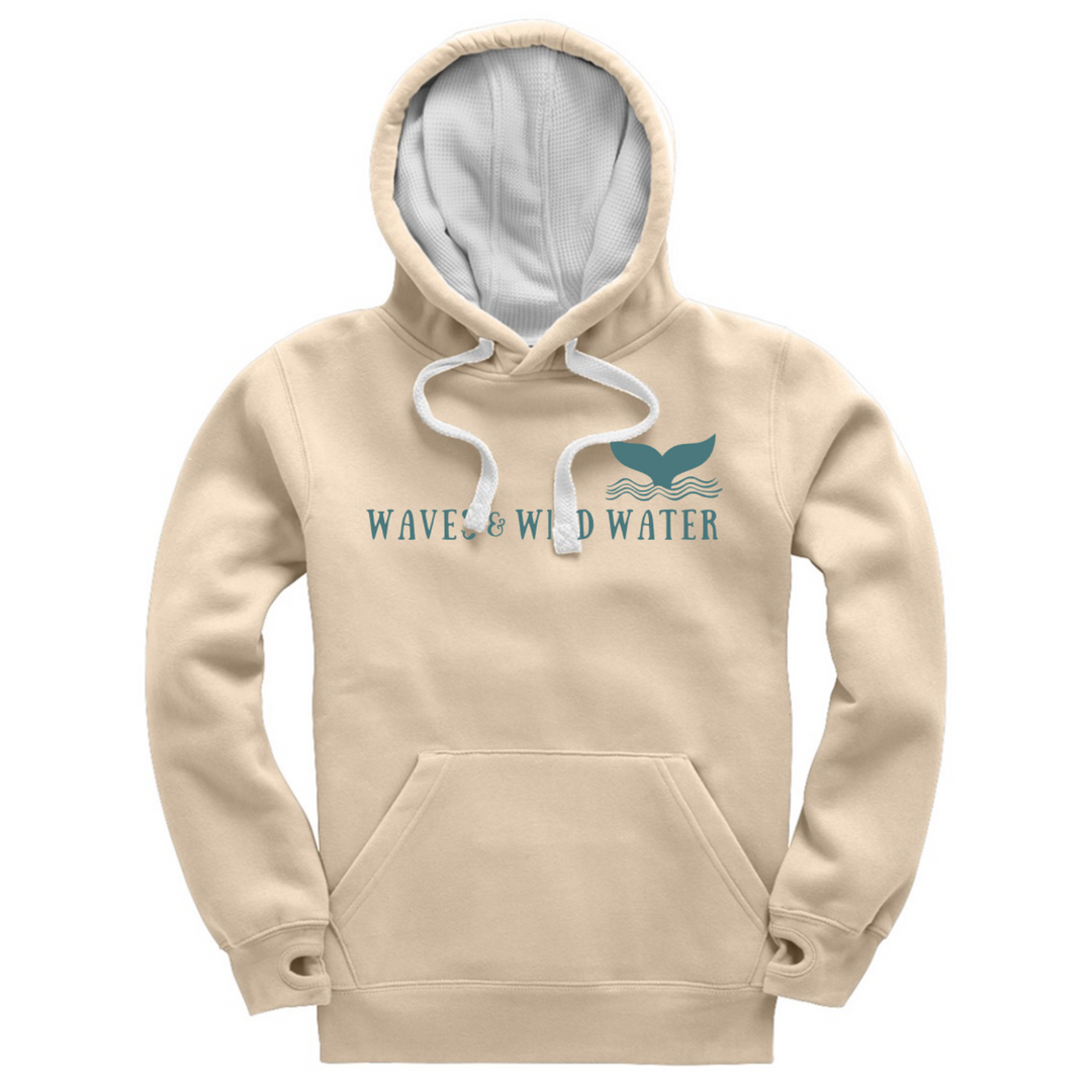 The front of our exclusive heavyweight hoodie for wild swimmers and sea dippers. This hoodie in Winter Swim ivory has a contrasting white waffle hood lining and matching cord. The logo is displayed across the front in Waves and Wild Water branded blue ink.